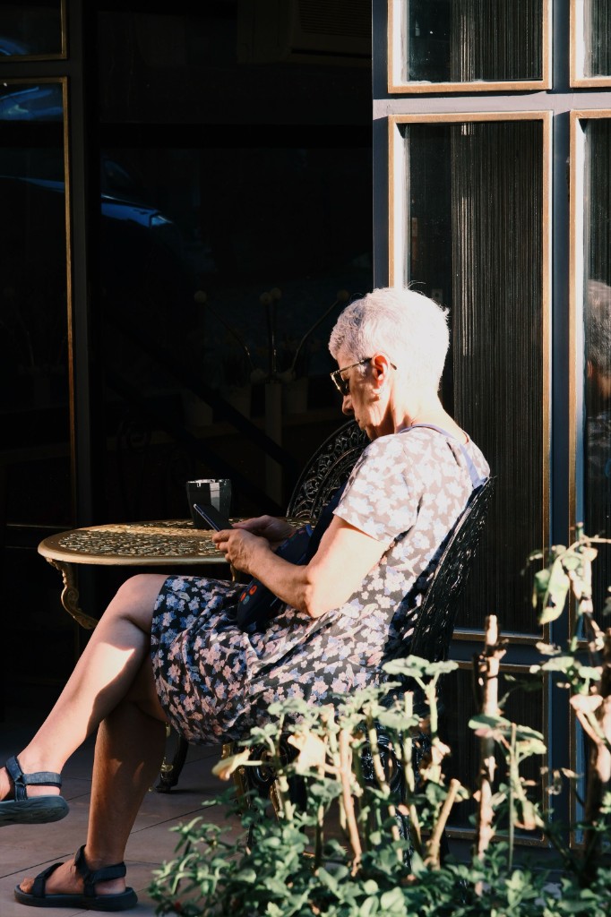 An older woman outdoors — healthy aging is about staying engaged, mobile, and present in daily life