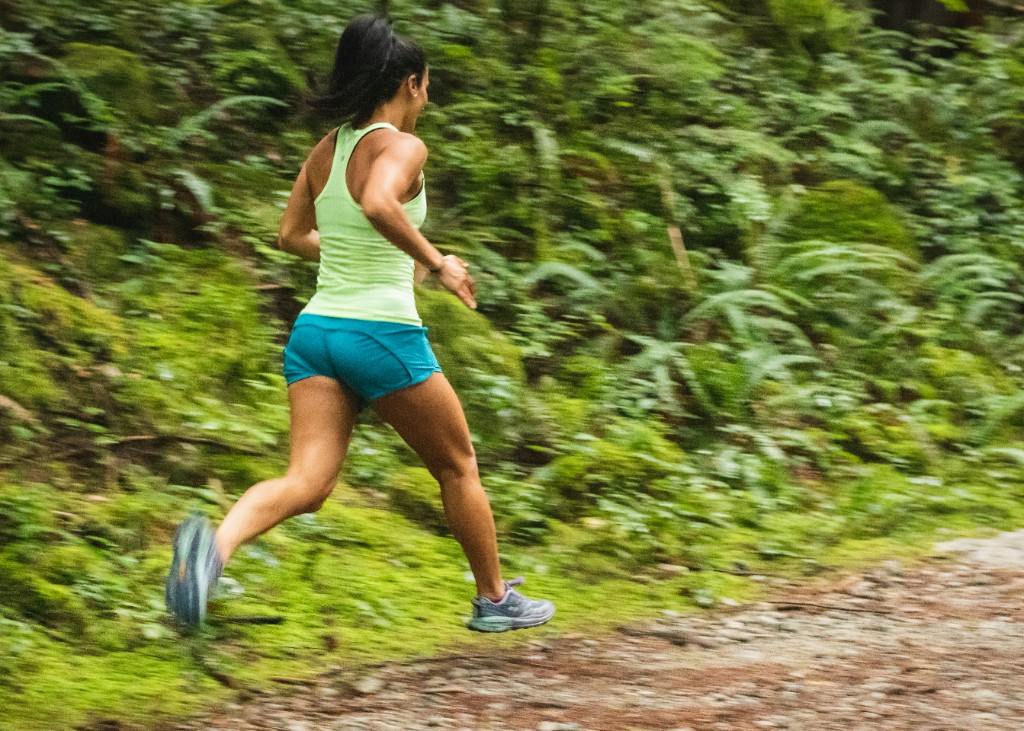 Running on a forest trail — consistent cardio supports heart health, mood, and daily energy