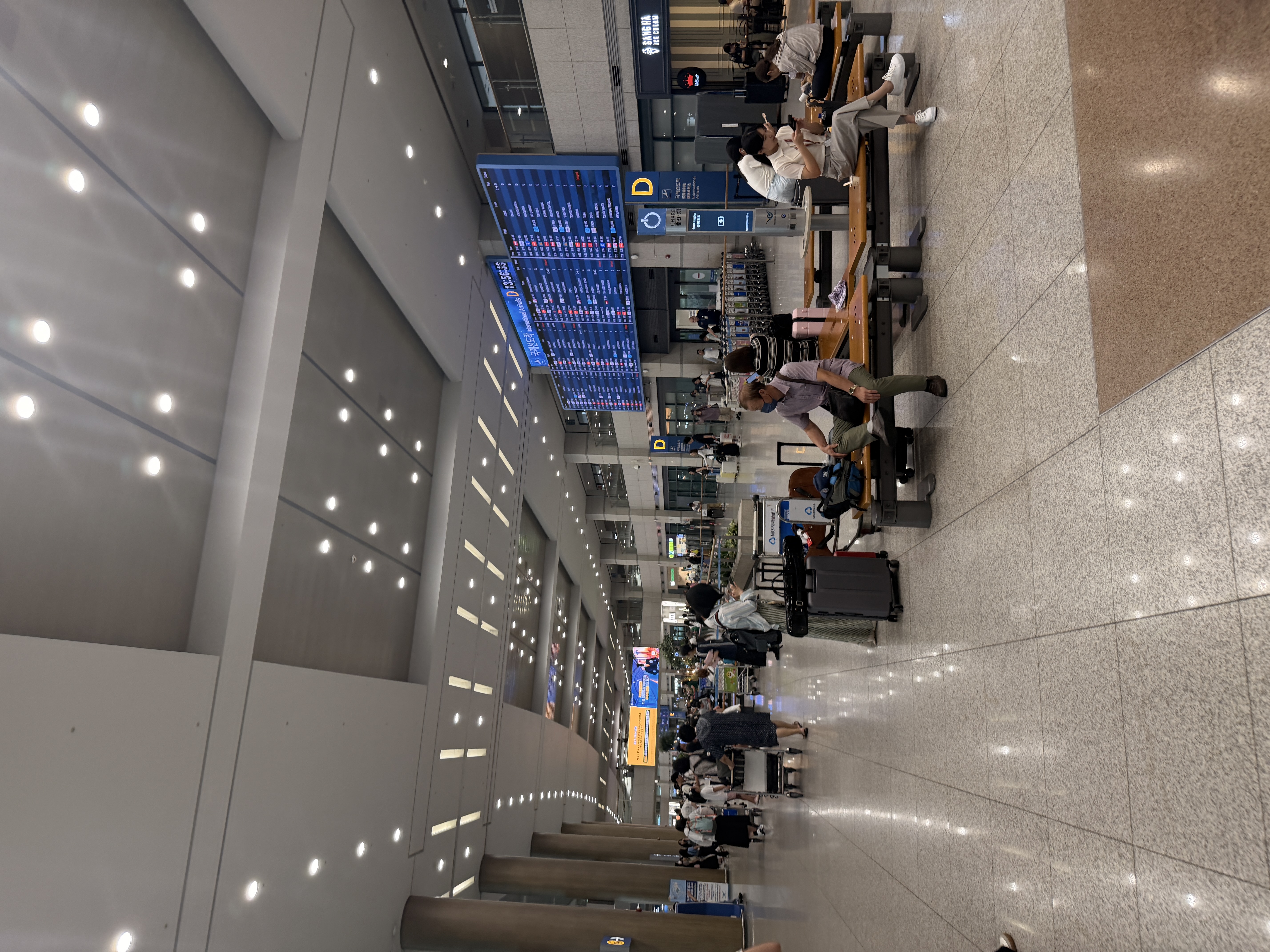 International arrivals board at Incheon Airport Gate D