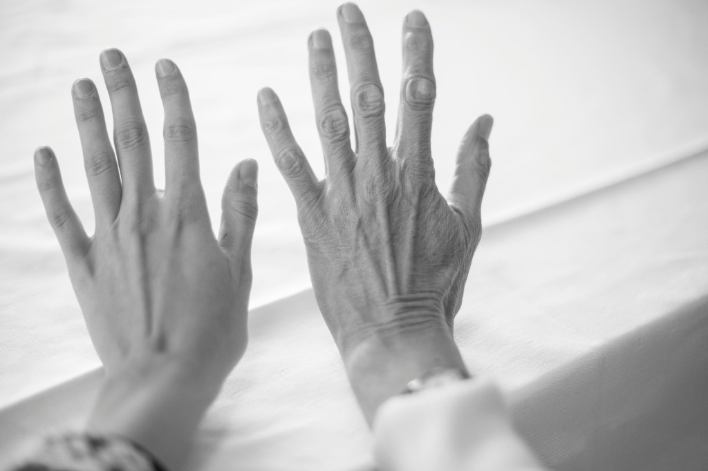 Young and aged hands side by side — the quiet, visible signs of aging many people notice over time