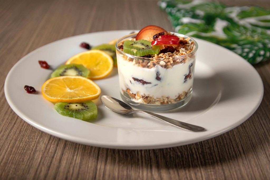 Greek yogurt parfait with fruit and granola — keep sweet toppings small for a balanced bowl